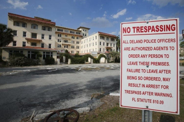 A sign warns trespassers outside of DeLand's historic Hotel Putnam, pictured here in 2017. A number of individuals and companies have made attempts over the years to rehabilitate the building, but a structural engineer on Thursday, Dec. 29, 2022, recommended the building in its entirety be demolished due to deterioration.