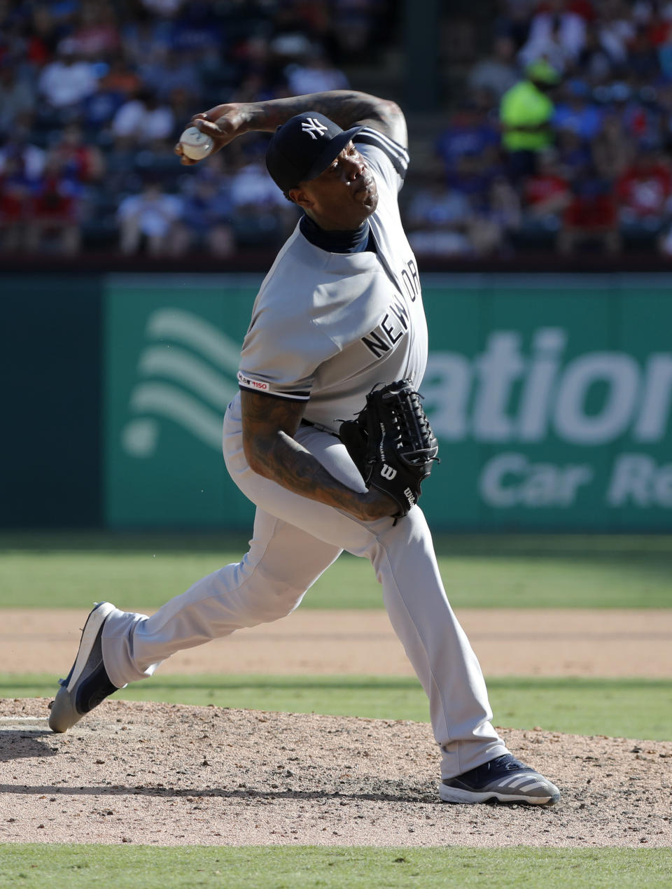 New York Yankees relief pitcher Aroldis Chapman throws to the Texas Rangers in the eighth inning of a baseball game in Arlington, Texas, Sunday, Sept. 29, 2019. (AP Photo/Tony Gutierrez)