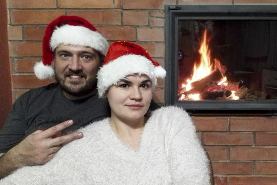 In this handout family photo taken by Sviatlana Tsikhanouskaya, Sviatlana Tsikhanouskaya and her husband Syarhei Tsikhanousky, who has remained in jail since his arrest in May on charges of assailing a police officer that he has dismissed as a provocation, pose for a selfie as they celebrate the New Year on Sunday, Jan. 1, 2017. Tsikhanouskaya told the AP that the arrest of her husband, a popular opposition blogger who was aspiring to run for president, left her no other choice but to enter politics. (Sviatlana Tsikhanouskaya via AP)