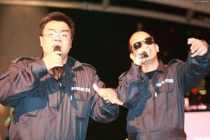 Two emcees dressed as PUB servicemen