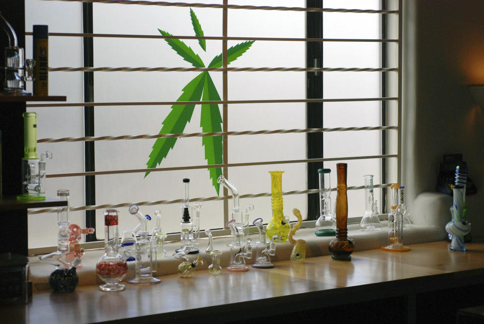 FILE - In this Tuesday, June 11, 2019, file photo, marijuana equipment sits on display along a window at the Minerva medical cannabis dispensary in Santa Fe, N.M. The U.S. government is explicitly barring federal dollars for opioid addiction treatment from being used on medical marijuana. (AP Photo/Morgan Lee, File)