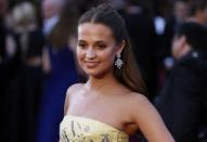 Alicia Vikander, nominated for Best Supporting Actress in "The Danish Girl," wearing a yellow Louis Vuitton gown with silver embellishments arrives at the 88th Academy Awards in Hollywood, California February 28, 2016. REUTERS/Lucas Jackson