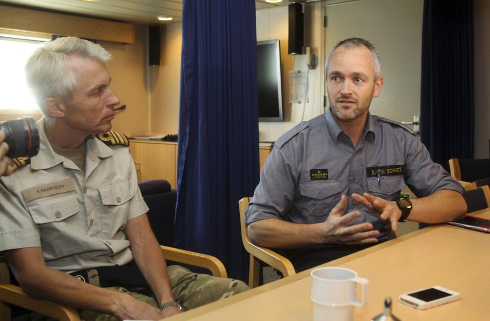 Danish chemist Bjorn Schmidt (R) speaks to the media, as part of a joint Danish-Norwegian task force that is to assist in the transportation of lethal chemical weapons out of Syria, at Limassol December 14, 2013. A Danish-led task force was being readied in Cyprus on Saturday to remove the first part of Syria's deadly chemical stockpile, due before the end of this year. Under a deal worked out between the United States and Russia, Syria will relinquish control of deadly toxins which can be used to make sarin, VX gas and other lethal agents. Denmark and Norway plan to use two cargo vessels to transport the cargo out of the Syrian port city of Latakia, escorted by two frigates of their respective navies, and deliver it to the Organisation for the Prohibition of Chemical Weapons (OPCW) for destruction. REUTERS/Andreas Manolis (CYPRUS - Tags: MILITARY POLITICS)