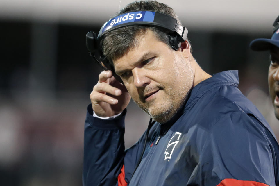 In this Nov. 28, 2019 photo, Mississippi head coach Matt Luke removes his headset during an NCAA college football game against Mississippi State, in Starkville, Miss. Mississippi has fired Luke, three days after his third non-winning season ended with an excruciating rivalry game loss. Athletic director Keith Carter said Sunday, Dec. 1, 2019 the decision to change coaches was made after evaluating the trajectory of the program and not seeing enough “momentum on the field.” (AP Photo/Rogelio V. Solis)