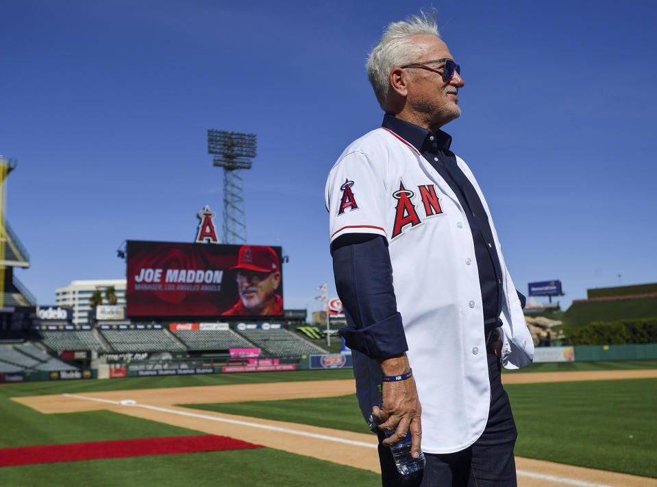 Los Angeles Angels manager Joe Maddon chats with visitors to a news conference introducing him as manager of the baseball team, at Angel Stadium in Anaheim, Calif., Thursday, Oct. 24, 2019. (Jeff Gritchen/The Orange County Register via AP)