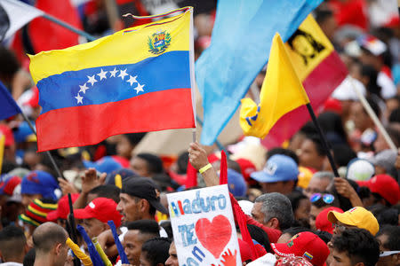 Supporters of Venezuela's President Nicolas Maduro attend his closing campaign rally in Caracas, Venezuela, May 17, 2018. REUTERS/Carlos Garcia Rawlins