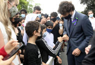 <p>Prime Minister Justin Trudeau greets mourners at a vigil for the victims of the deadly vehicle attack on five members of the Canadian Muslim community in London, Ont., on Tuesday, June 8, 2021. Four of the members of the family died and one is in critical condition. Police have charged a London man with four counts of murder and one count of attempted murder. THE CANADIAN PRESS/Nathan Denette</p> 