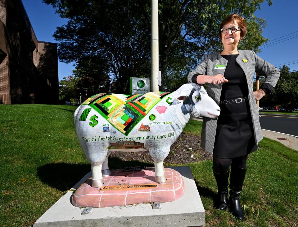 Webster Five market manager Brenda Sullivan with the bank's Slater's Sheep, Cash-mere.