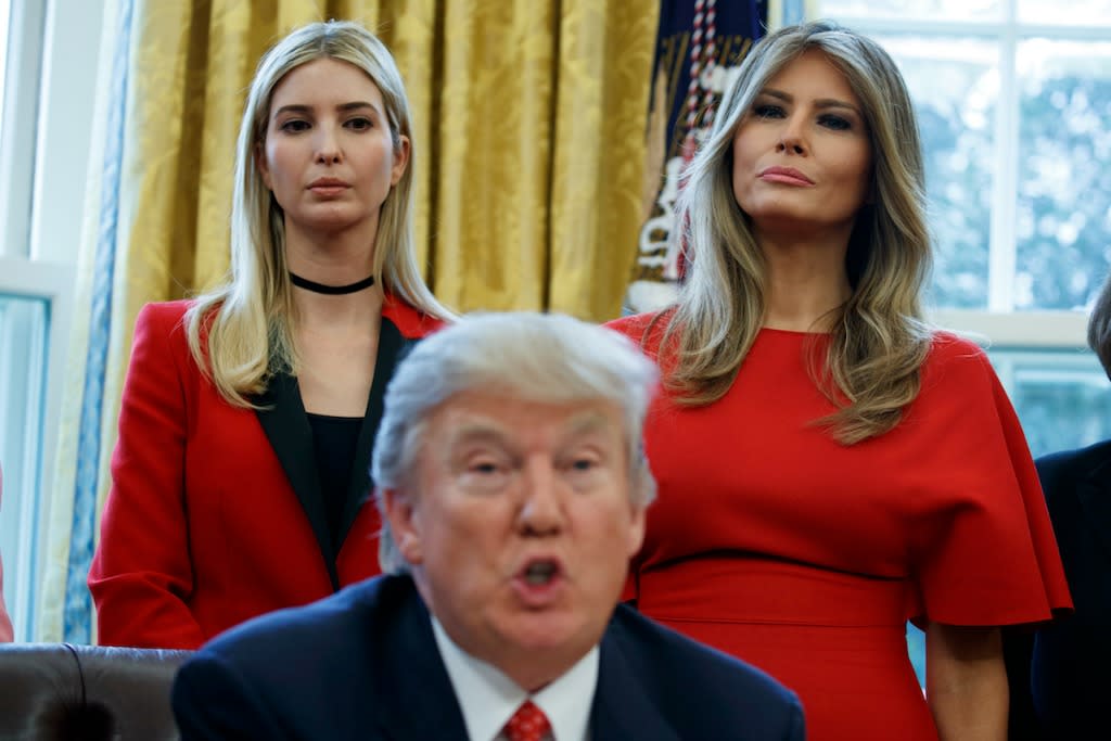 Ivanka Trump wore a power color and a simple black choker as her father, the president, signed two female-empowerment bills in the Oval Office. (Photo: AP Images)