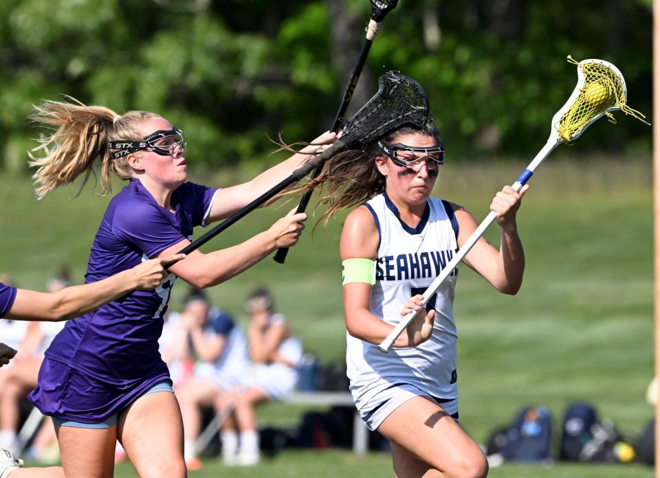 OSTERVILLE   6/02/23 Ella Bartolomei of Cape Cod Academy goes in for one of her goals past Violet Macphail of Martha's Vineyard