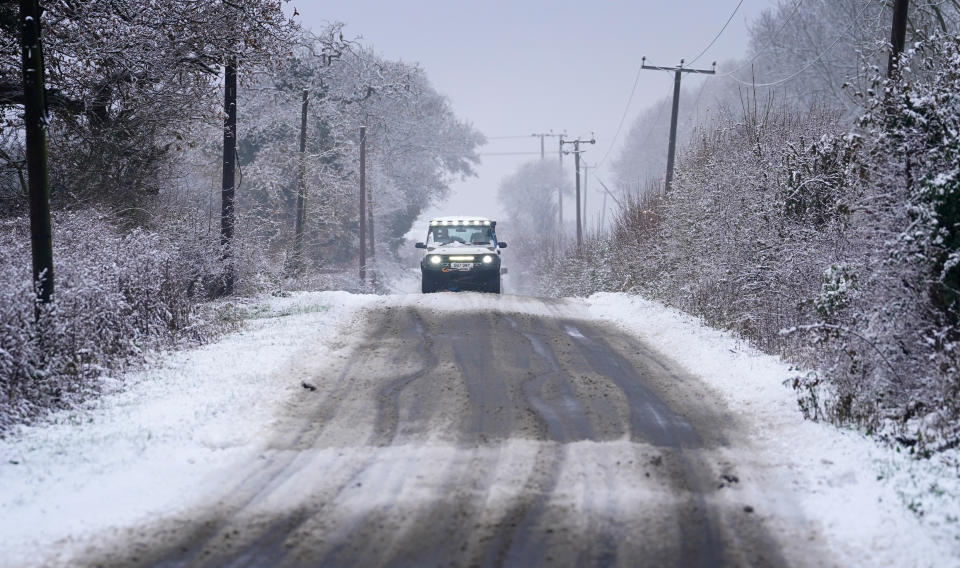 A four-wheel drive car drives along an icy road in Ashford, Kent. Snow and ice have swept across parts of the UK, with cold wintry conditions set to continue for days. Picture date: Monday December 12, 2022. (Photo by Gareth Fuller/PA Images via Getty Images)