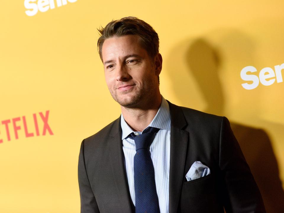 Justin Hartley wearing a suit.