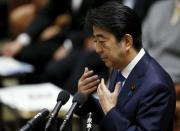 Japan's Prime Minister Shinzo Abe speaks at a lower house special committee session on security-related legislation at the parliament in Tokyo July 15, 2015. REUTERS/Toru Hanai