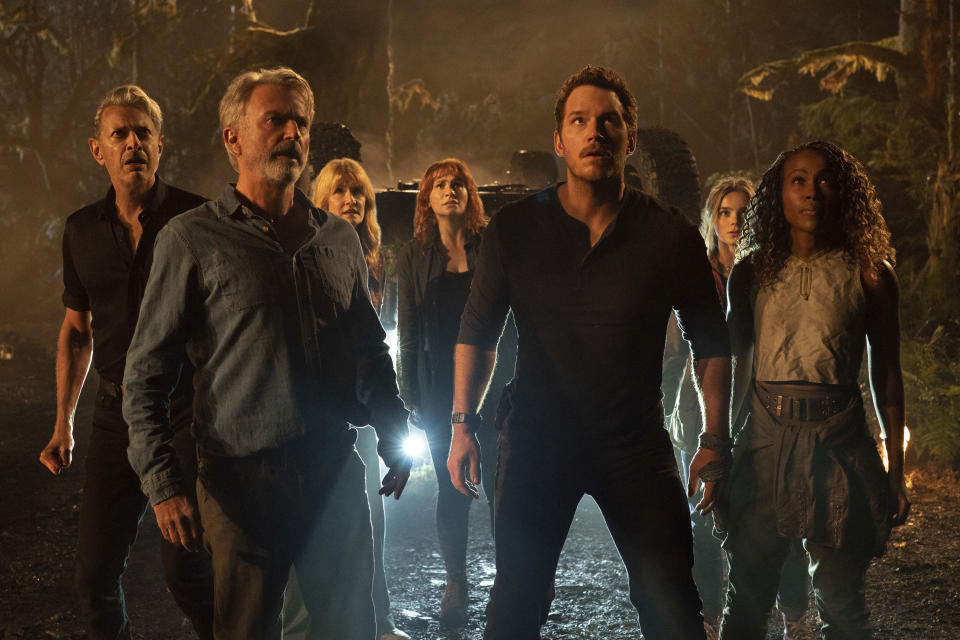 This image released by Universal Pictures shows, from left, Jeff Goldblum, Sam Neill, Laura Dern, Bryce Dallas Howard, Chris Pratt, Isabella Sermon and DeWanda Wise in a scene from "Jurassic World Dominion." (Universal Pictures and Amblin Entertainment via AP)