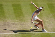 Kazakhstan's Elena Rybakina returns to Romania's Simona Halep in a women's singles semifinal match on day eleven of the Wimbledon tennis championships in London, Thursday, July 7, 2022. (AP Photo/Gerald Herbert)