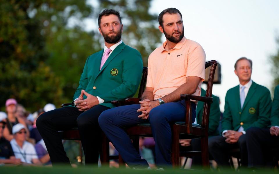 Scottie Scheffler sits with Jon Rahm