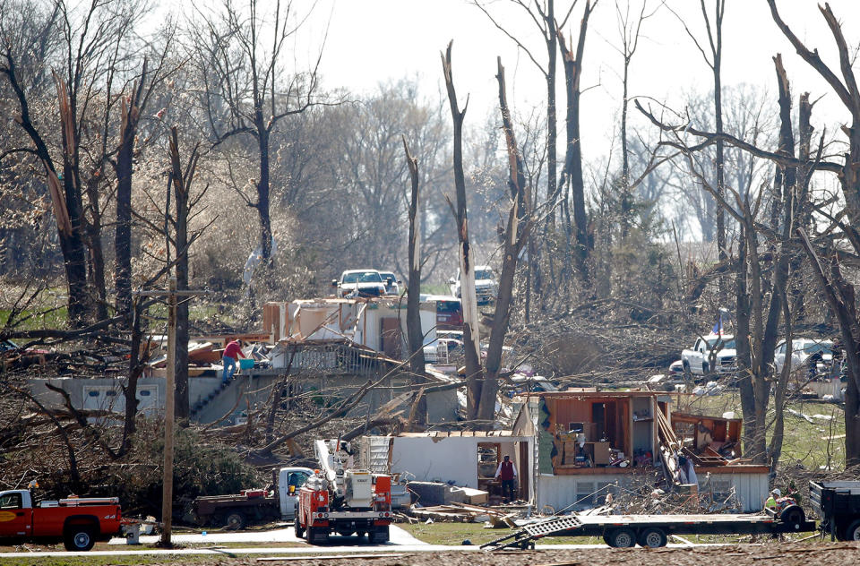 Destroyed homes and trees striped bare by tornado