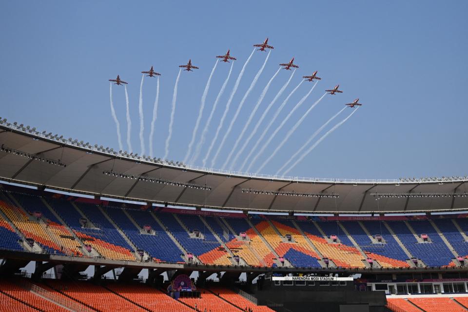 Indian Air Force Surya Kiran aircrafts perform an aerobatic display over the Narendra Modi Stadium in Ahmedabad on November 17, 2023, during a rehearsal ahead of the 2023 ICC Men's Cricket World Cup ODI final match between India and Australia on November 19.