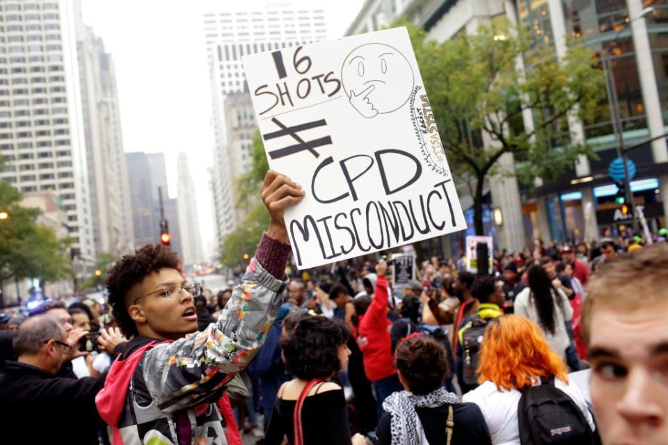 Demonstrators protest as they celebrate the verdict in the murder trial of Chicago police officer Jason Van Dyke along Michigan Avenue in Chicago, Illinois. (Photo by Joshua Lott/Getty Images)