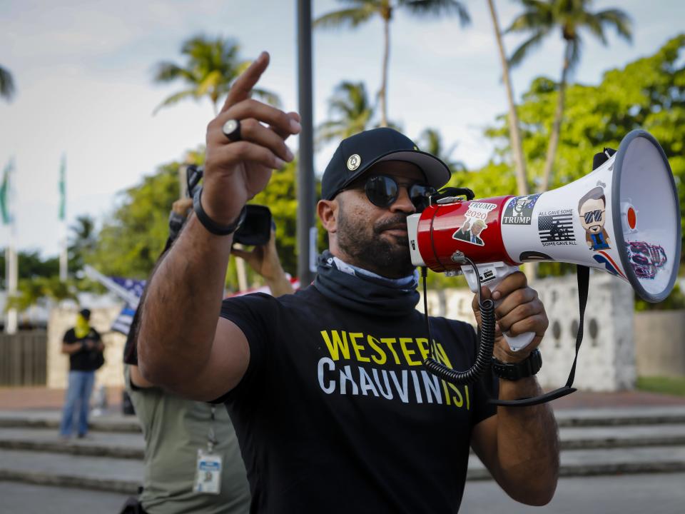 Enrique Tarrio, former leader of the Proud Boys, speaks to Black Lives Matters supporters during a commemoration of the death of George Floyd in Miami on May 25, 2021.