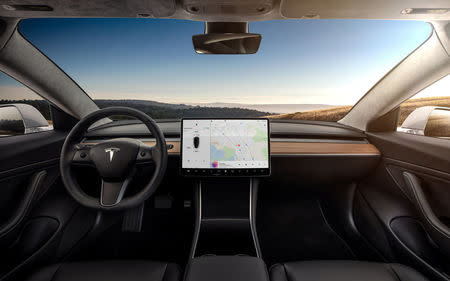 The interior of the Tesla Model 3 sedan is seen in this undated handout image as the car company handed over its first 30 Model 3 vehicles to employee buyers at the company’s Fremont facility in California, U.S. on July 28, 2017. Tesla/Handout via REUTERS