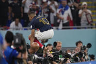 France's Kylian Mbappe celebrates scoring his side's second goal against Denmark during a World Cup group D soccer match at the Stadium 974 in Doha, Qatar, Saturday, Nov. 26, 2022. (AP Photo/Martin Meissner)
