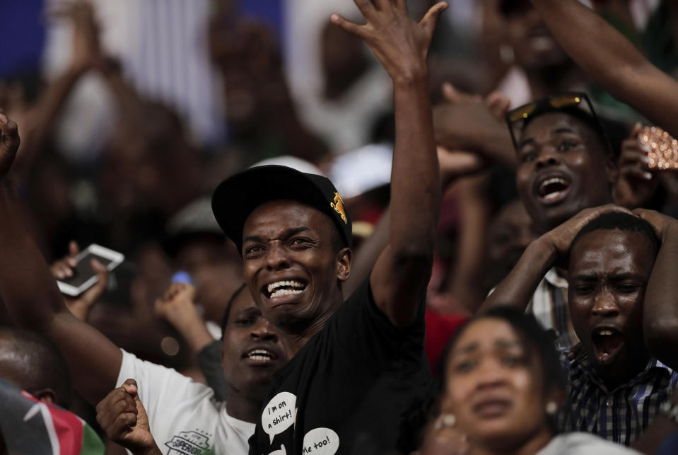 Kenyan fans react as Hellen Obiri of Kenya races to the gold medal in the women's 5000 meter final at the World Athletics Championships in Doha, Qatar, Saturday, Oct. 5, 2019. (AP Photo/Nariman El-Mofty)