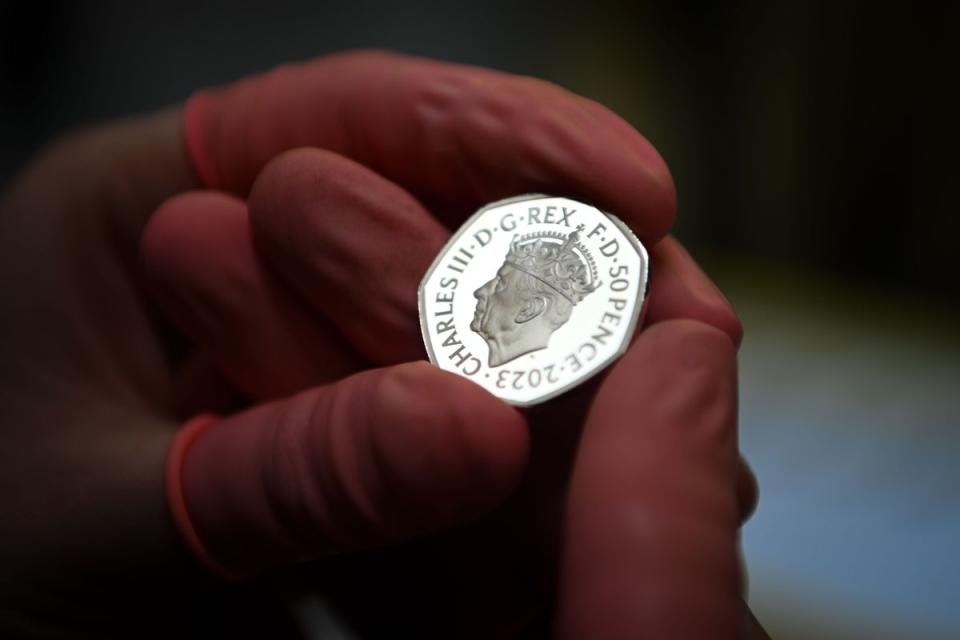 A commemorative 50 pence coin is checked for flaws after striking at The Royal Mint (Getty Images)