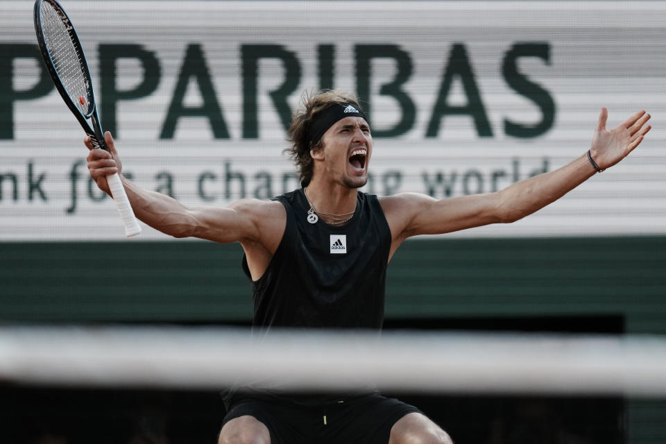 Germany's Alexander Zverev celebrates as he defeats Spain's Carlos Alcaraz during their quarterfinal match of the French Open tennis tournament at the Roland Garros stadium Tuesday, May 31, 2022 in Paris. Zverev won 6-4-, 6-4, 4-6, 7-6 (9/7). (AP Photo/Thibault Camus)