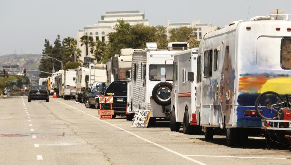 A street lined with parked RVs.