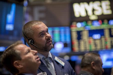 Traders work on the floor of the New York Stock Exchange September 16, 2014. REUTERS/Brendan McDermid