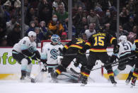 Vancouver Canucks' Luke Schenn (2) scores against Seattle Kraken goalie Joey Daccord (35) during the third period of an NHL hockey game Tuesday, April 26, 2022, in Vancouver, British Columbia. (Darryl Dyck/The Canadian Press via AP)