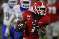 Georgia running back D'Andre Swift (7) drives in for Georgia's first touchdown of the night, in the second half against Kentucky during an NCAA college football game Saturday, Oct. 19, 2019, in Athens, Ga. (Joshua L. Jones/Athens Banner-Herald via AP)