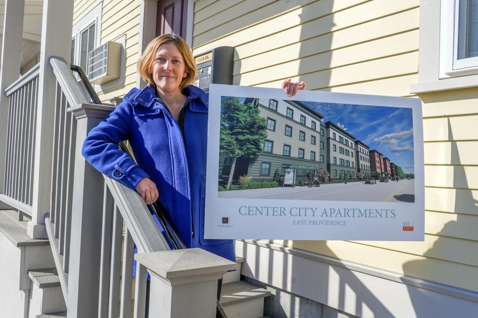 ONE Neighborhood Builders CEO Jennifer Hawkins shows a rendering of the "Center City" affordable apartments that her nonprofit agency hopes to build on Taunton Avenue in East Providence.