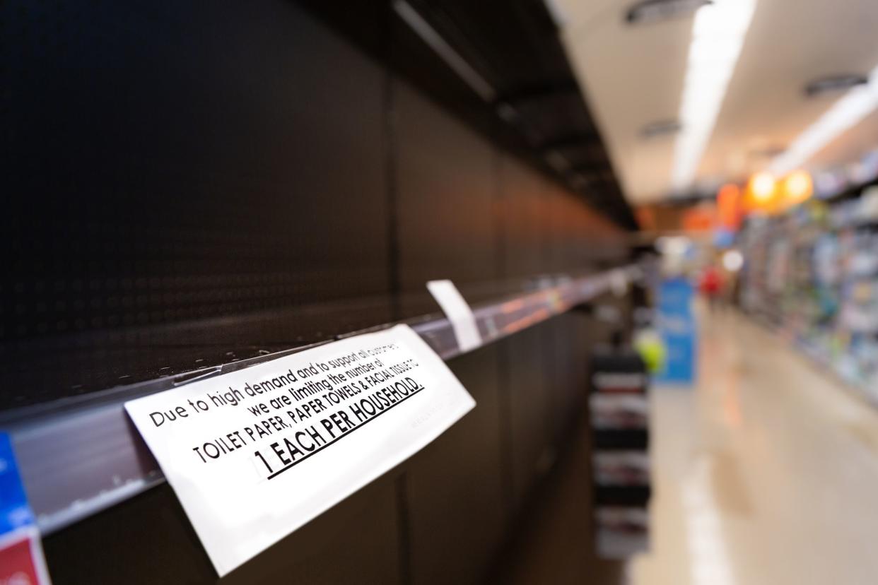 Empty store shelves with food and supplies shortage and limits during virus epidemic.