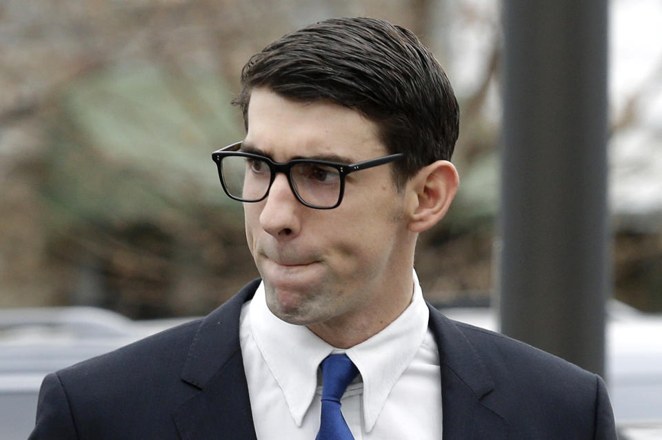 FILE - In this Dec. 19, 2014, file photo, Olympic swimmer Michael Phelps walks into a courthouse for a trial on drunken driving and other charges in Baltimore. After revealing the depths of his depression _ and even thoughts of suicide after his second drunken-driving arrest _ Phelps is hoping to make a difference for those who are dealing with similar issues. The 23-time Olympic gold medalist announced a partnership with Talkspace, which provides online therapy, and said he considers it a higher calling than anything he ever did as a swimmer. (AP Photo/Patrick Semansky, File)