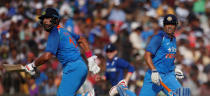 Cricket - India v England - Second One Day International - Barabati Stadium, Cuttack, India - 19/01/17. India's Mahendra Singh Dhoni and Yuvraj Singh run between the wickets. REUTERS/Adnan Abidi