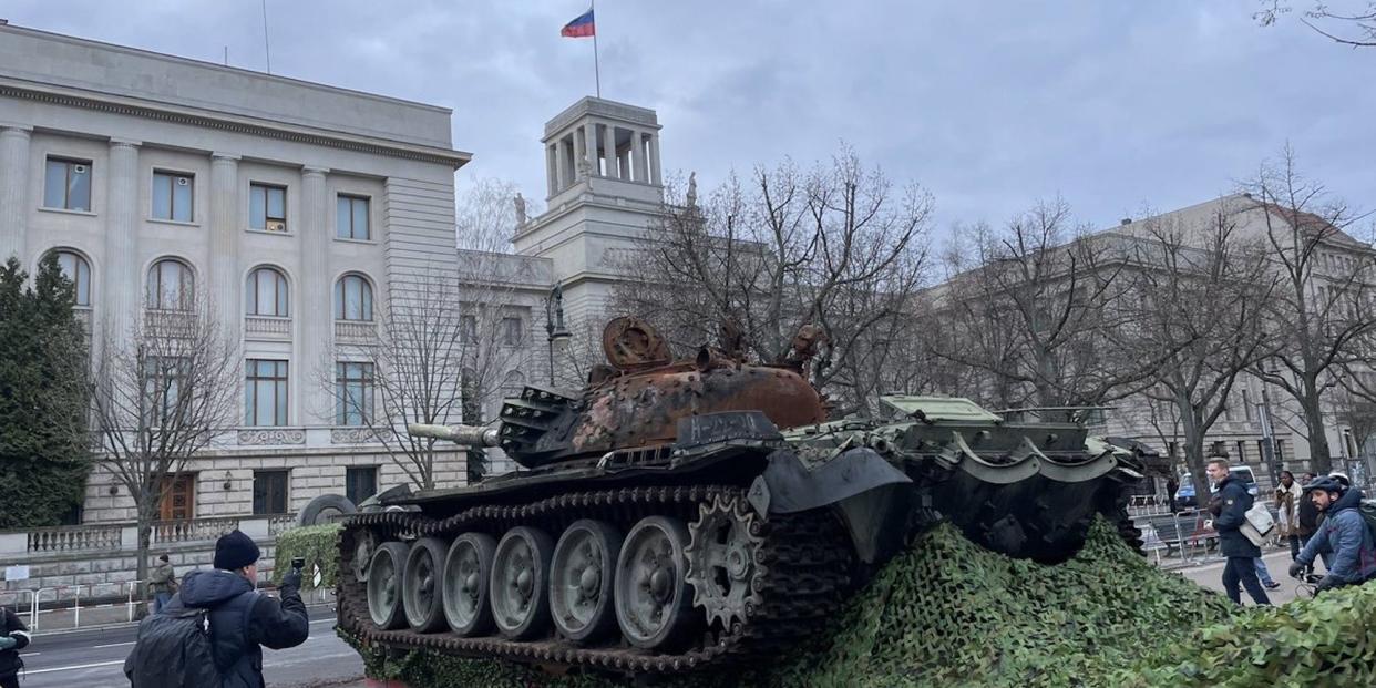 A ruined Russian T-72 tank sits on a flatbed truck outside the Russian embassy in Berlin, in February 2023.