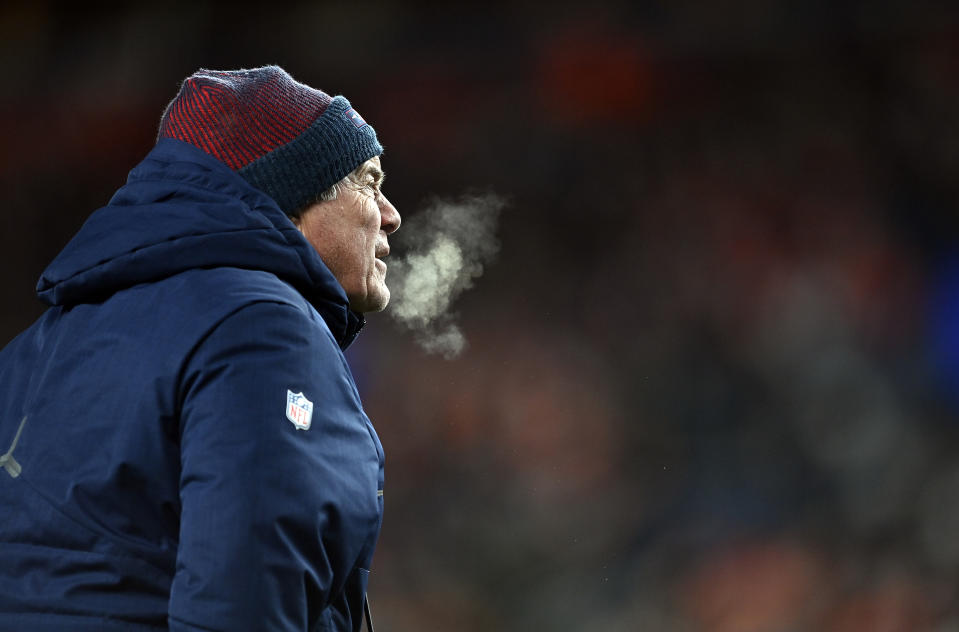 DENVER, COLORADO - DECEMBER 24:  Head coach Bill Belichick of the New England Patriots watches from the sidelines during the 2nd quarter of the game against the Denver Broncos at Empower Field At Mile High on December 24, 2023 in Denver, Colorado. (Photo by Dustin Bradford/Getty Images)