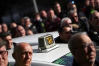 Striking taxi drivers protest outside IFEMA fairgrounds during a taxi strike against regulation of ride-hailing and car-sharing services such as Uber and Cabify in Madrid, Spain, January 24, 2019. REUTERS/Susana Vera