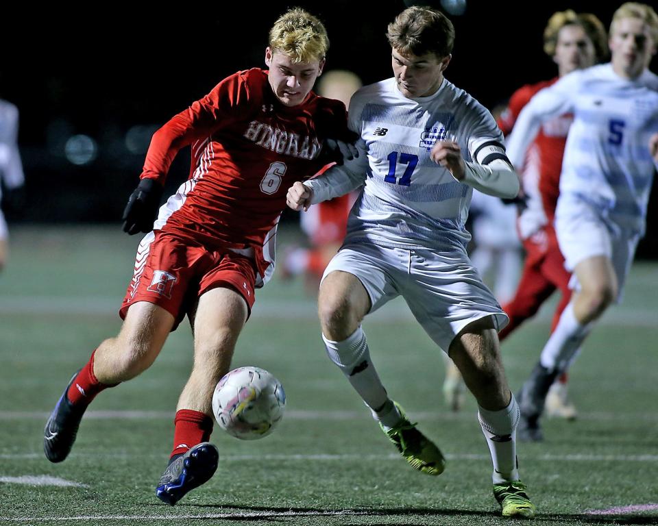 Hingham’s Christopher Connelly and West Side’s Owen Hall battle for the ball during first half action of their game against West Side in the Sweet 16 round of the Division 2 state tournament at Hingham High on Wednesday, Nov. 8, 2023. Hingham would go on to win 1-0.