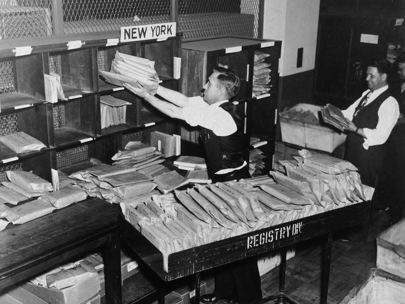 Postal workers wearing ties and vests in 1936