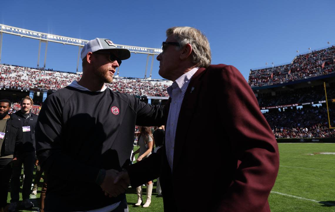 Former South Carolina coach Steve Spurrier is greeted by former players during halftime of the Gamecocks’ game at Williams-Brice Stadium in Columbia on Saturday, November 4, 2023.