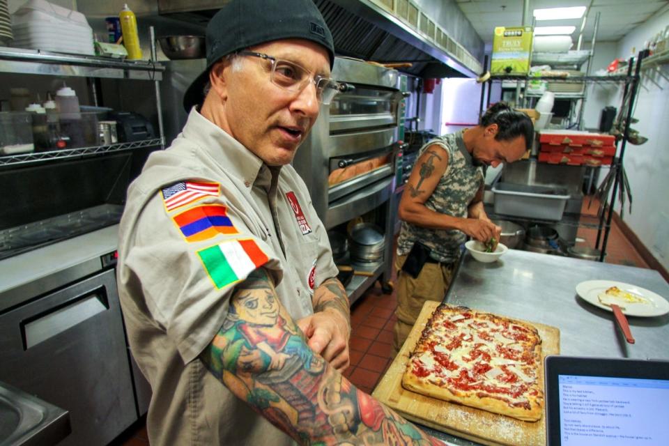 Billy Manzo, owner of Federal Hill Pizza in Warren and Providence, is a “master pizzaioli,” certified in Italy. "Pizza is an art," he says. [The Providence Journal / David DelPoio]