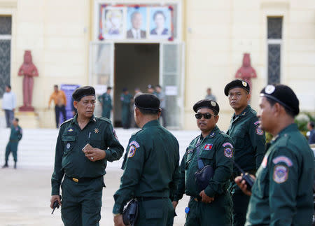 Police officers stand guard at the Supreme Court during a hearing to decide whether to dissolve the main opposition Cambodia National Rescue Party (CNRP), in Phnom Penh, Cambodia, November 16, 2017. REUTERS/Samrang Pring