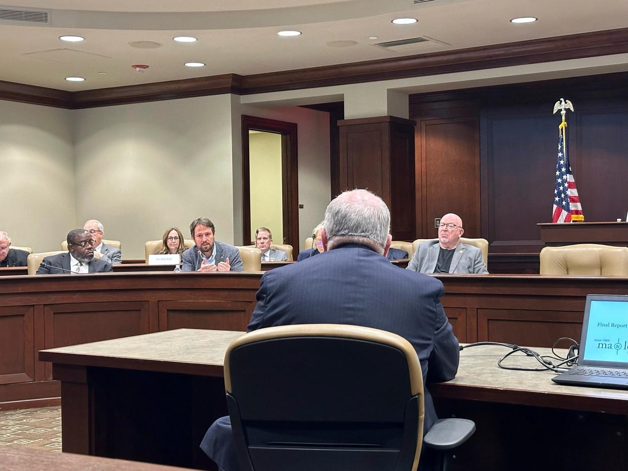 Arkansas state Sen. Clarke Tucker asks state Finance and Administration Secretary Jim Hudson about the state's change in driver's license policy at a hearing at the state Capitol complex in Little Rock, Ark. on Thursday, March 14, 2024. The state announced it would no longer allow residents to choose "X" instead of male or female on state-issued driver's licenses and identification cards. A legislative panel approved the emergency rules for the new policy. (AP Photo/Andrew DeMillo)