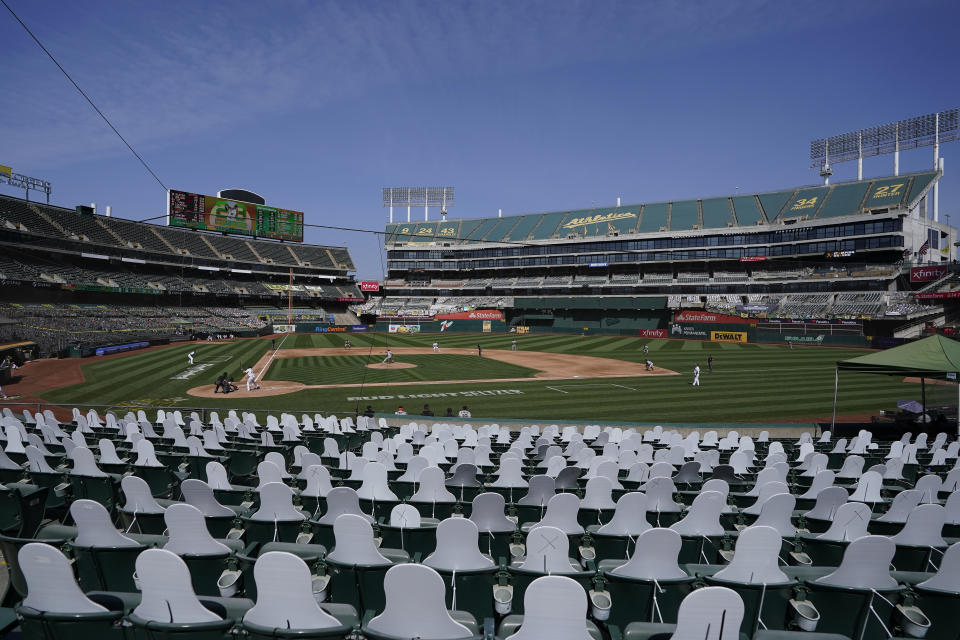 Cutouts are seated at Oakland Coliseum as San Francisco Giants' Kevin Gausman pitches to Oakland Athletics' Matt Olson during the fourth inning of a baseball game in Oakland, Calif., Saturday, Sept. 19, 2020. (AP Photo/Jeff Chiu)