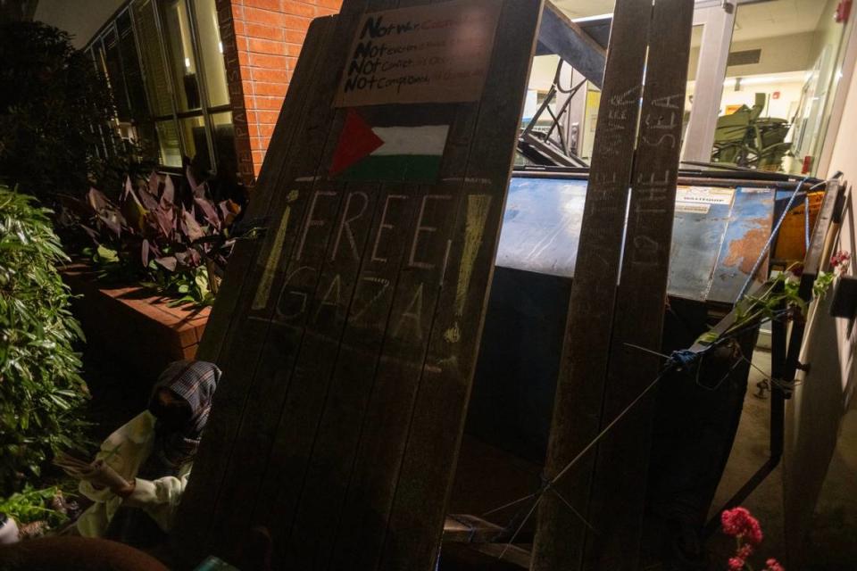 Cal Poly Humboldt student Laura Sanchez sits outside of Siemens Hall, which has been occupied by students and community members calling for a permanent ceasefire in Gaza, on Tuesday, April 23, 2024, in Arcata. Paul Kitagaki Jr./pkitagaki@sacbee.com