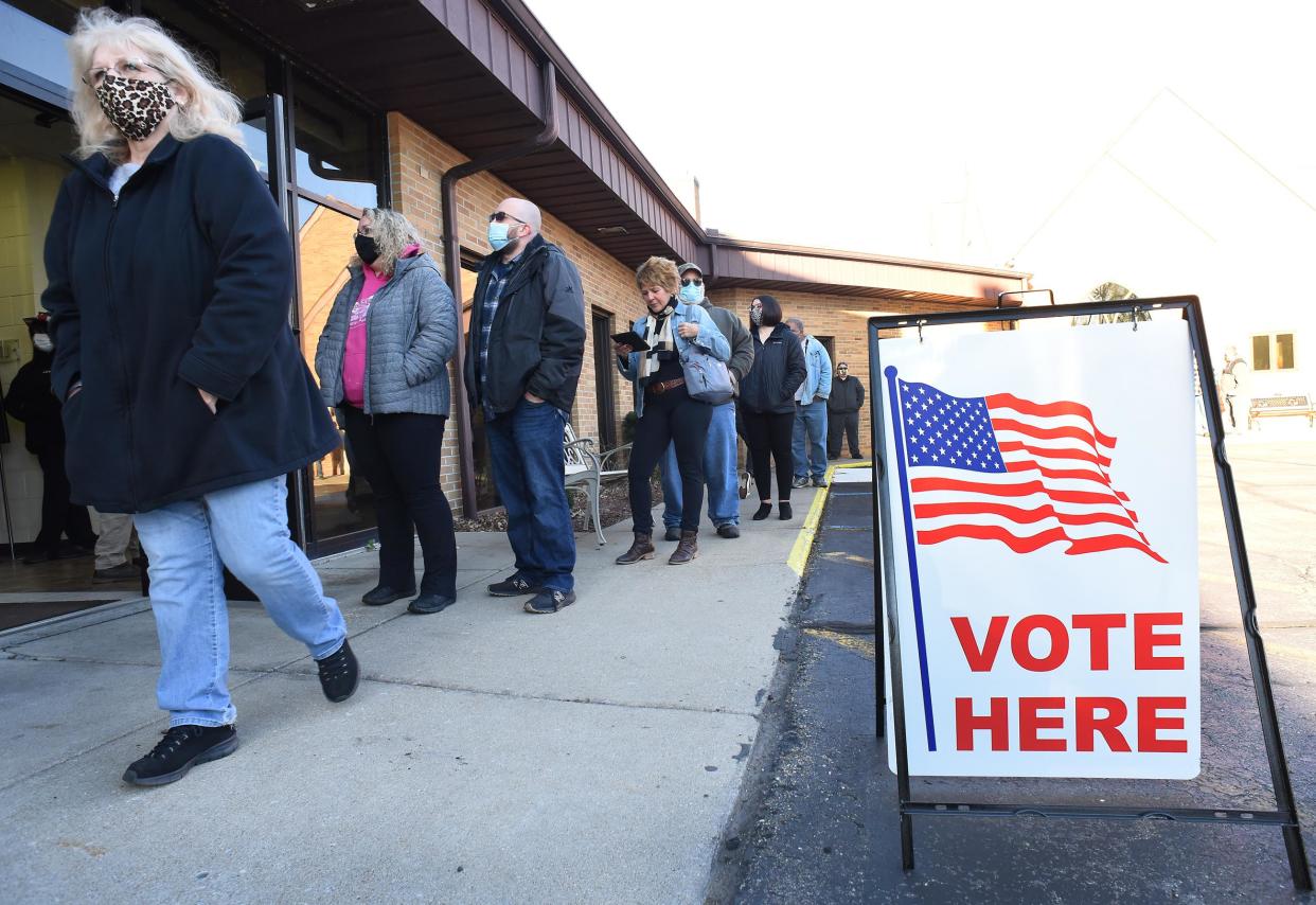 Residents of the City of Monroe wait in line Tuesday morning to vote in this Monroe News file photo.