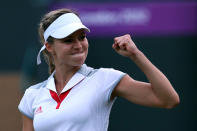 LONDON, ENGLAND - JULY 31: Maria Kirilenko of Russia celebrates defeating Heather Watson of Great Britain in the second round of Women's Singles Tennis on Day 4 of the London 2012 Olympic Games at Wimbledon on July 31, 2012 in London, England. (Photo by Clive Brunskill/Getty Images)